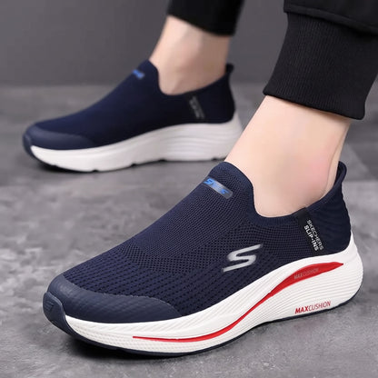 A pair of slip-on athletic sneakers shown on a model&