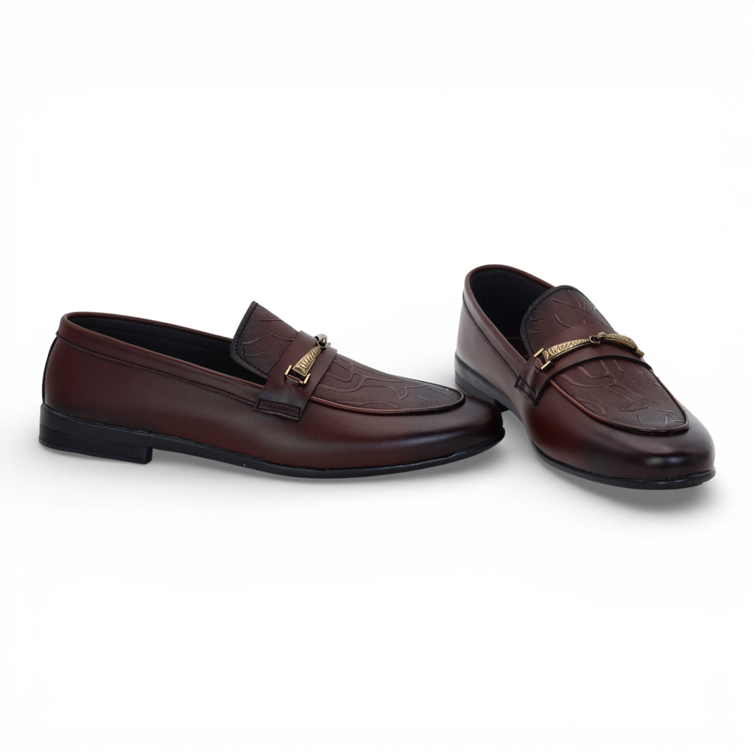 Pair of brown loafers with gold accents on a white background